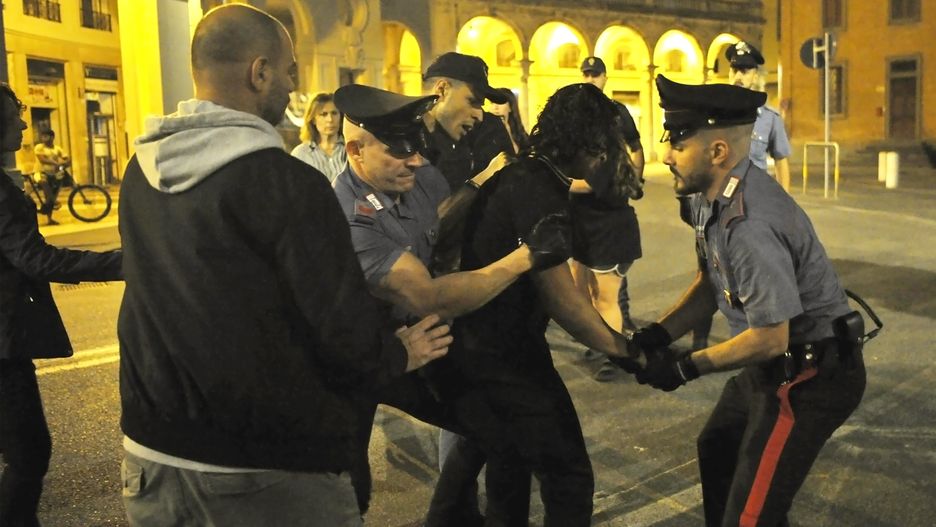 LIVORNO, ITALY - OCTOBER 12: A pro-Palestine person is arrested by the police after brief clashes at the end of a demonstration in support of Israel on October 12, 2023 in Livorno, Italy. On October 7, the Palestinian militant group Hamas launched the largest surprise attack from Gaza in a generation, sending thousands of missiles and an unknown number of fighters by land, who shot and kidnapped Israelis in communities near the Gaza border. The attack prompted retaliatory strikes on Gaza and a declaration of war by the Israeli prime minister. (Photo by Laura Lezza/Getty Images)