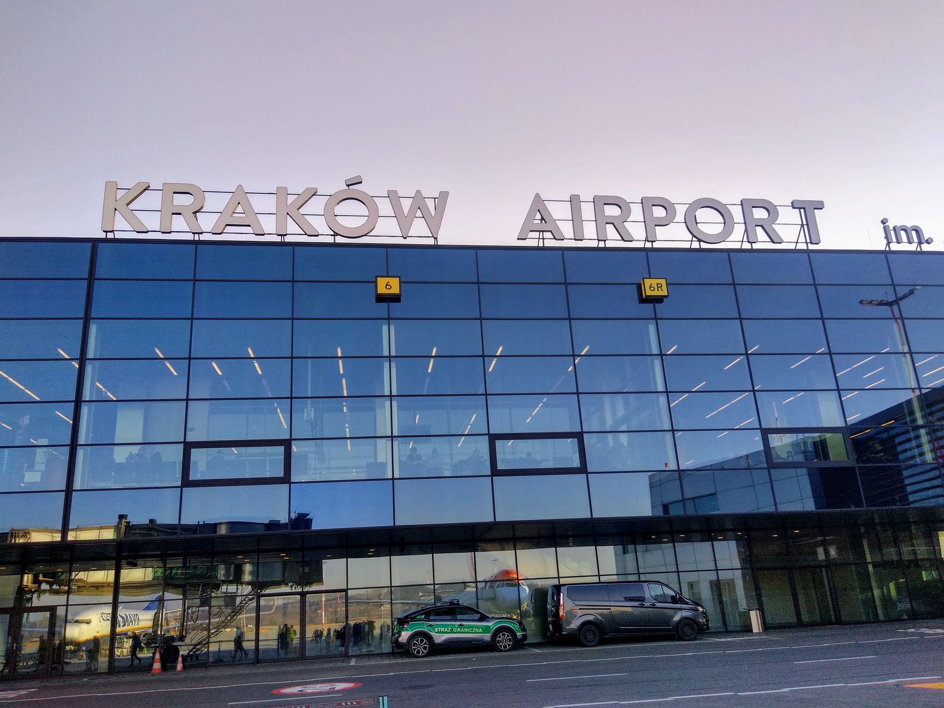 balice, krakow, airport, terminal, aviation, runway, apron, tarmac, travel, transportation, poland, europe, airfield, infrastructure, architecture, airline, aircraft, departure, arrival, airport building, exterior, modern, international airport, airport terminal, air travel, flight, aerial hub, commercial aviation, airport scenery, airport facilities, airport exterior, airport traffic, aviation industry, airport operations, urban travel, european airport, airport perspective, airport environment, airport view, aviation hub, airport logistics