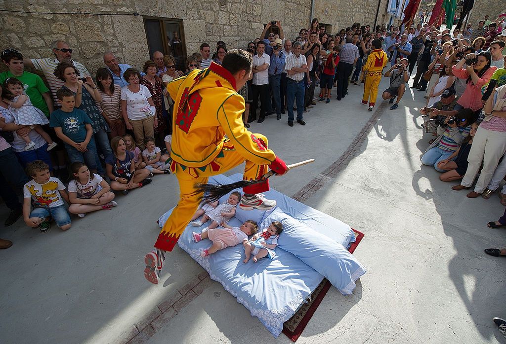El Colacho Corpus Christi CelebrationsCASTRILLO DE MURCIA, SPAIN - JUNE 22:  A man representing the devil leaps over babies during the festival of El Salto del Colacho (the devil's jump) on June 22, 2014 in Castrillo de Murcia, Spain. The festival, held on the first Sunday after Corpus Cristi, is a catholic rite of the devil cleansing babies of original sin.  (Photo by Denis Doyle/Getty Images)Denis DoyleHuman Interest, Religion, Spirituality