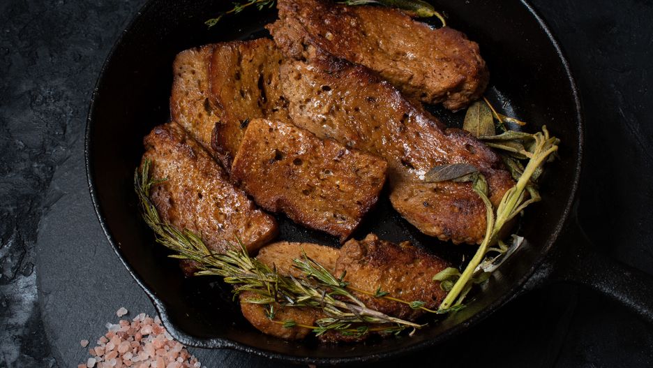 Roasted seitan in cast iron pan with various herbs and spices
roasted seitan, seitan steaks, cast iron cooking, cast iron pan, baked seitan, seitan, gluten, wheat gluten, vegan protein, plant based protein, plant origin protein, vegan meat, vegetarian protein, vegan meat alternative, healthy protein, plant based protein, plant steak, wheat potein, healthy lifestile, sustainable food, healthy, flavorful, nobody, no people, herbs, spices, mock meat