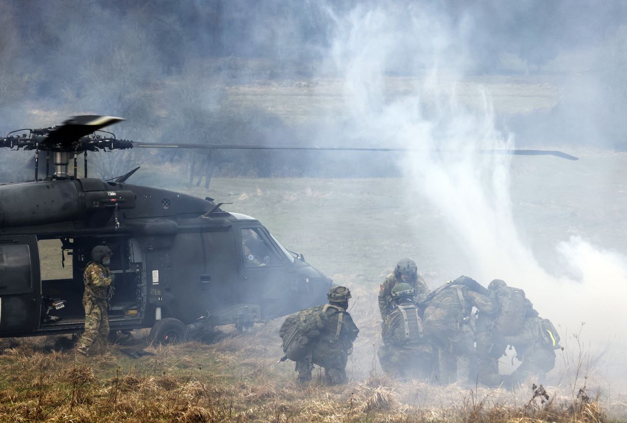 Soldiers of the German Bundeswehr move a soldier, acting injured, to a US Army Black Hawk helicopter during an Allied Spirit 24 multinational training exercise at the Hohenfels Training Area in Hohenfels, Germany, on Saturday, March 16, 2024. Allied Spirit 24 is a U.S. Army exercise for its NATO allies and partners, with participants from countries including Croatia, Denmark, Germany, Hungary, Italy, Lithuania, Netherlands, Spain, the UK and the US. Photographer: Alex Kraus/Bloomberg via Getty Images