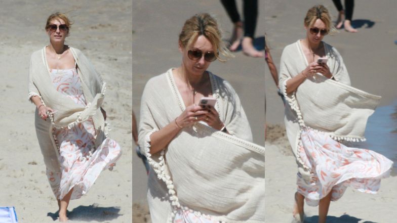 Anna Kalczyńska pije piwo na plaży i fotografuje pociechy