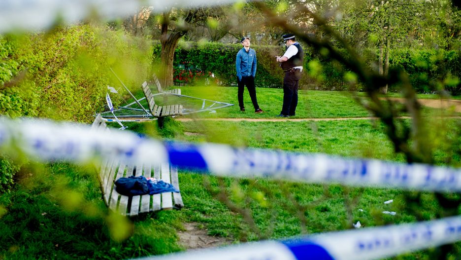 LONDON, ENGLAND - MARCH 25: Police investigating after a closed outdoor gym area at Primrose Hill with a Police tape covered fence and a sign explaining it is closed due to the contamination risk of Covid-19 was knocked down by people intent on using the facilities on March 25, 2020 in London, United Kingdom. British Prime Minister, Boris Johnson, announced strict lockdown measures urging people to stay at home and only leave the house for basic food shopping, exercise once a day and essential travel to and from work. The Coronavirus (COVID-19) pandemic has spread to at least 182 countries, claiming over 10,000 lives and infecting hundreds of thousands more. (Photo by Ollie Millington/Getty Images)