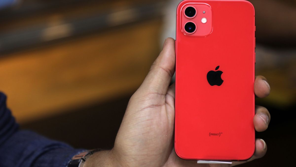 A Palestinian man holds Apple's new iPhone 12 at a mobile phone store in Gaza City on November 14, 2020. Apple's new iPhone 12 is selling well in the Gaza Strip despite inflated prices. (Photo by Majdi Fathi/NurPhoto via Getty Images)