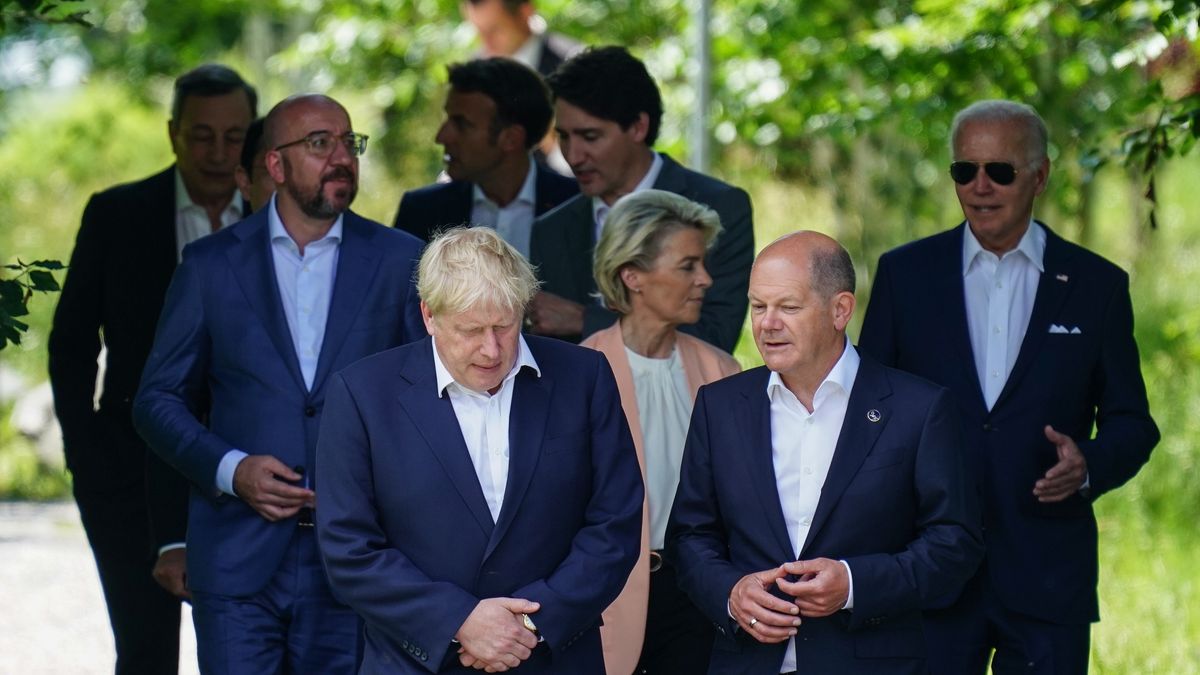 GARMISCH-PARTENKIRCHEN, GERMANY - JUNE 26: British Prime Minster Boris Johnson (L) talks to German Chancellor Olaf Scholz as they walk during the first day of the three-day G7 summit at Schloss Elmau on June 26, 2022 near Garmisch-Partenkirchen, Germany. Leaders of the G7 group of nations are officially coming together under the motto: "progress towards an equitable world" and will discuss global issues including war, climate change, hunger, poverty and health. Overshadowing this year's summit is the ongoing Russian war in Ukraine. (Photo by Clemens Bilan - Pool/Getty Images)