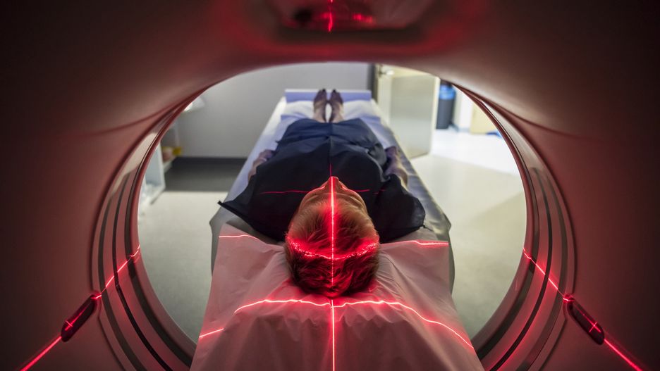 Patient lying inside a medical scanner in hospitalPerson undergoing a CAT scan in hospital. PET scan equipment. Medical CT scan of patient.JohnnyGreigAnatomy, Diagnostic Medical Tool, Glowing, Medical Scanner, Medical Scan, Medical Procedure, Ominous, Lighting Equipment, Examination Gown, PET Scan, PET Scan Machine, Medical Exam, CAT Scan, Adult, Symmetry, Lying Down, MRI Scanner, X-ray, Biology, One Person, Illuminated, Expertise, Accuracy, Discovery, Exploration, Care, Cross Shape, Red, Modern, Below, Healthcare And Medicine, Technology, Science, X-ray Image, MRI Scan, Indoors, Horizontal, Unusual Angle, Human Head, Human Brain, Human Skull, The Human Body, Illness, Patient, People, Sydney, Australia, Hospital, Musical Instrument, CAT Scan Machine, Medical Equipment, Equipment, Machinery, PitchAUS2015, LypseAUS2015