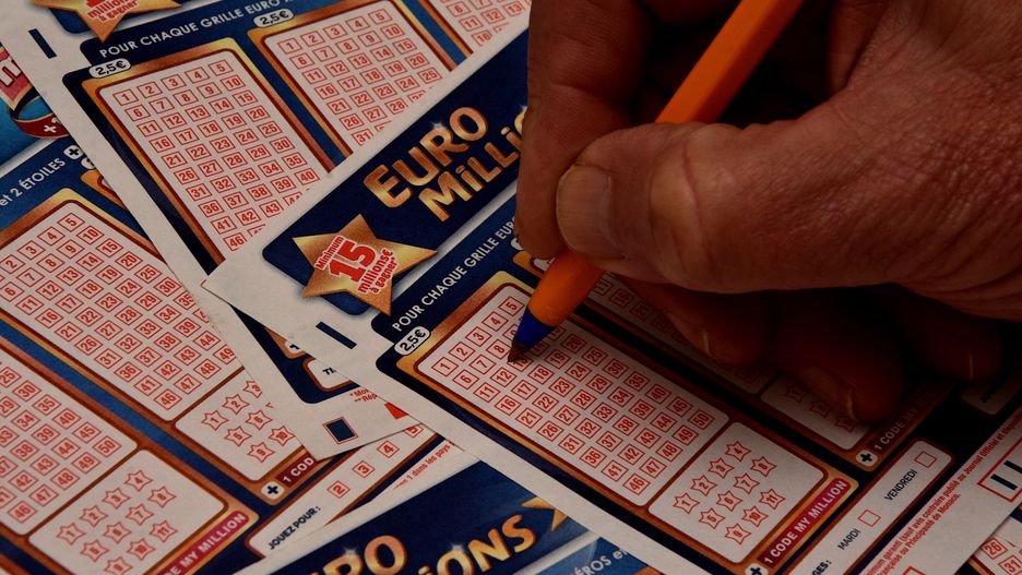 FRANCE - 2023/12/07: In this photo illustration, a man is about to check a box on a grid of a EuroMillions game slip. A historic jackpot of 240 million euros will be put into play for the EuroMillions draw on Friday December 8, 2023. This is the largest sum ever put into play since the launch of the lottery in 2004. (Photo Illustration by Gerard Bottino/SOPA Images/LightRocket via Getty Images)