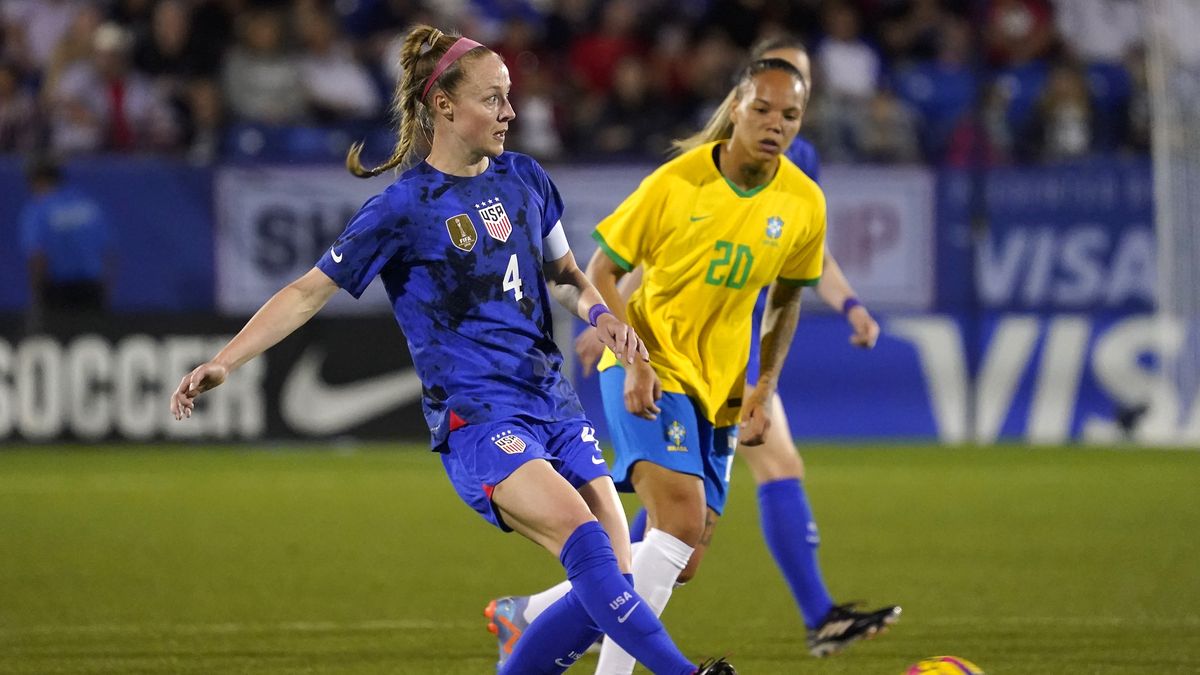 FRISCO, TEXAS - FEBRUARY 22: Becky Sauerbrunn #4 of the United States passes the ball against Nycole #20 of Brazil during the first half in the 2023 SheBelieves Cup match at Toyota Stadium on February 22, 2023 in Frisco, Texas. (Photo by Sam Hodde/Getty Images)