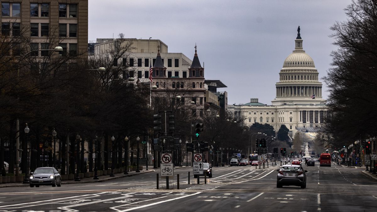 WASHINGTON, DC - DECEMBER 20: The US Capitol building is seen down Pennsylvania Avenue on December 20, 2020 in Washington, DC. Republicans and Democrats in the Senate finally came to an agreement on the coronavirus relief bill and a vote is expected later today. (Photo by Samuel Corum/Getty Images)