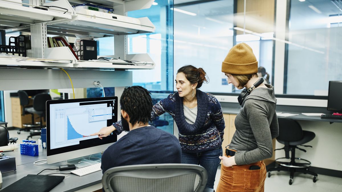 Scientists examining data on computer while working in research lab
Thomas Barwick
