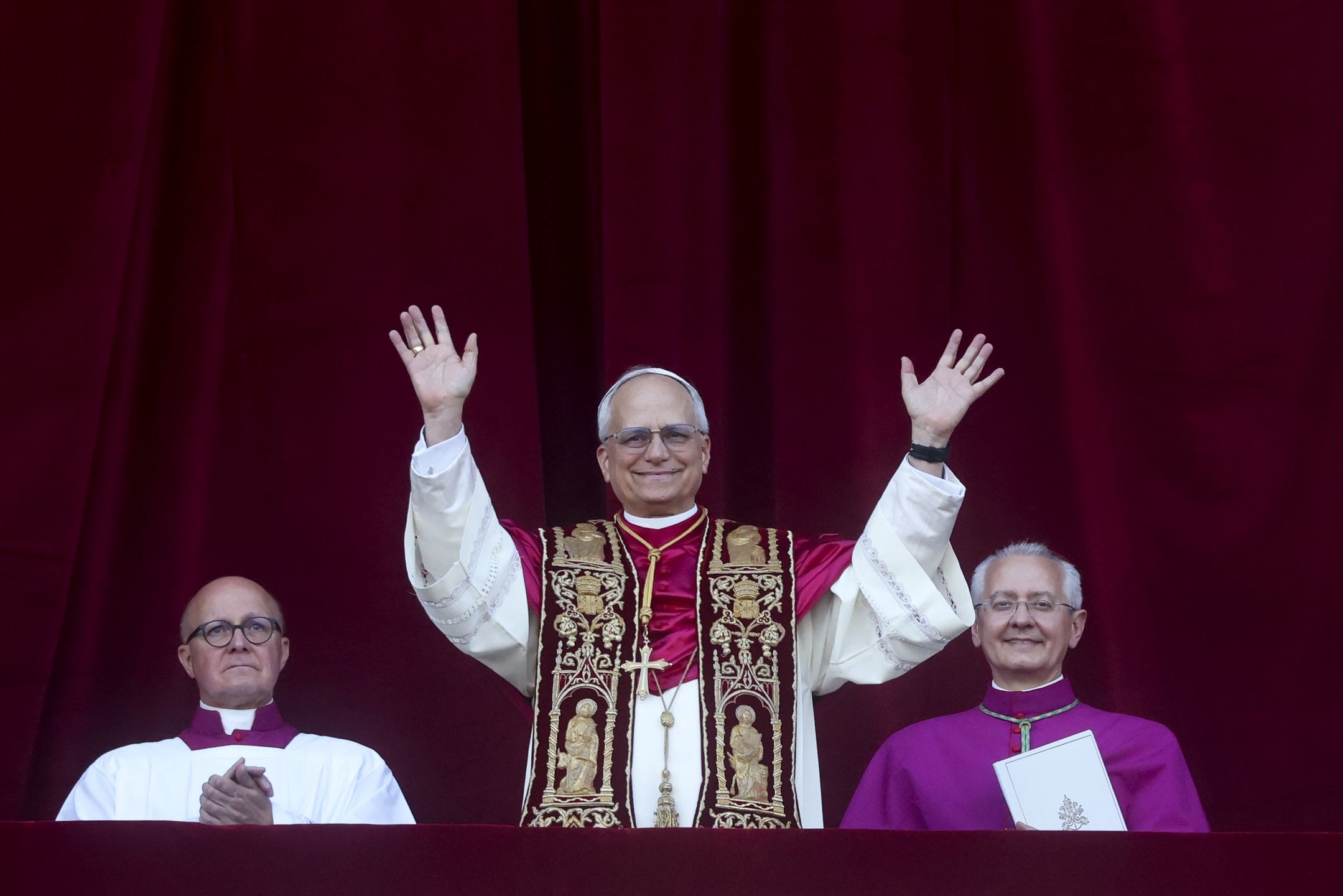 VATICAN CITY, VATICAN - MAY 08: Newly elected Pope Leo XIV, Cardinal Robert Francis Prevost, greets the faithful as he appears from the Central Loggia of St. Peter's Square on May 08, 2025 in Vatican City, Vatican. Cardinals of the Catholic Church have descended on Vatican City to commence the papal conclave, the secretive voting process held in the Sistine Chapel that requires a two-thirds majority to elect the new leader of the Catholic Church. The election follows the death of Pope Francis on April 21 at the age of 88. (Photo by Alessandra Benedetti - Corbis/Corbis via Getty Images)