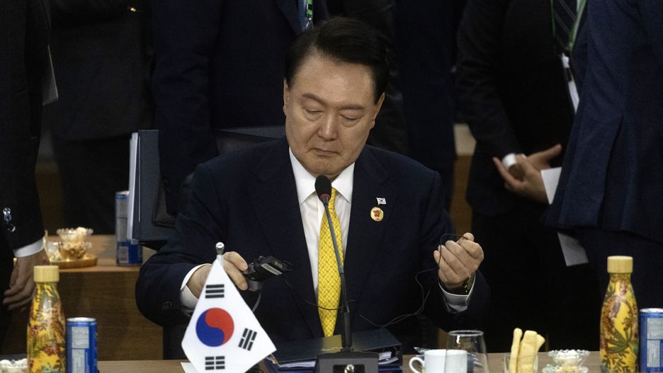 Yoon Suk Yeol, South Korea's president, at the opening of the Global Alliance Against Hunger session during the Group of 20 (G-20) Leaders' Summit in Rio de Janeiro, Brazil, on Monday, Nov. 18, 2024. G-20 leaders meeting in Brazil this week are set to show unity on climate action and global trade rules, two areas threatened by US President-elect Donald Trump, as talks continue on how to characterize Russia's war in Ukraine and tensions in the Middle East. Photographer: Dado Galdieri/Bloomberg via Getty Images