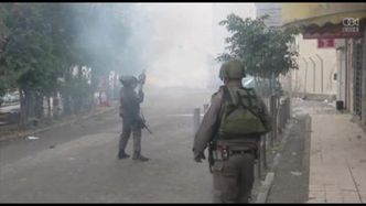 Palestyńscy demonstranci starli się z izraelską policją niedaleko muru bezpieczeństwa na Zachodnim Brzegu