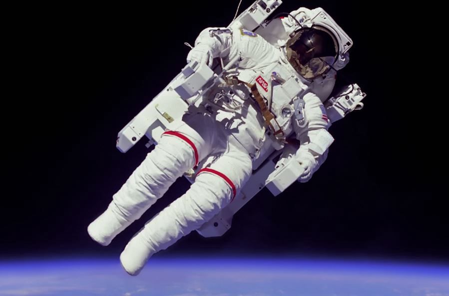 An astronaut in space. Without a suit, he would die in less than a minute and a half.