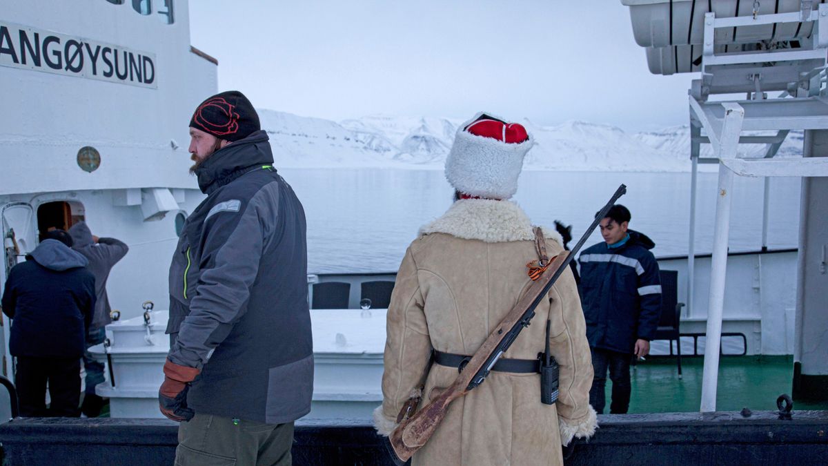SVALBARD, NORWAY - 2015/10/15: Guides and Pyramiden guide Sacha Romanovsky (R) from St. Petersburg, Russia, seen at the former Soviet coal mining settlement of Pyramiden. Pyramiden was closed in 1998 and largely abandoned. The miners were mainly from the Donbas region of eastern Ukraine. (Photo by Joe M O'Brien/SOPA Images/LightRocket via Getty Images)