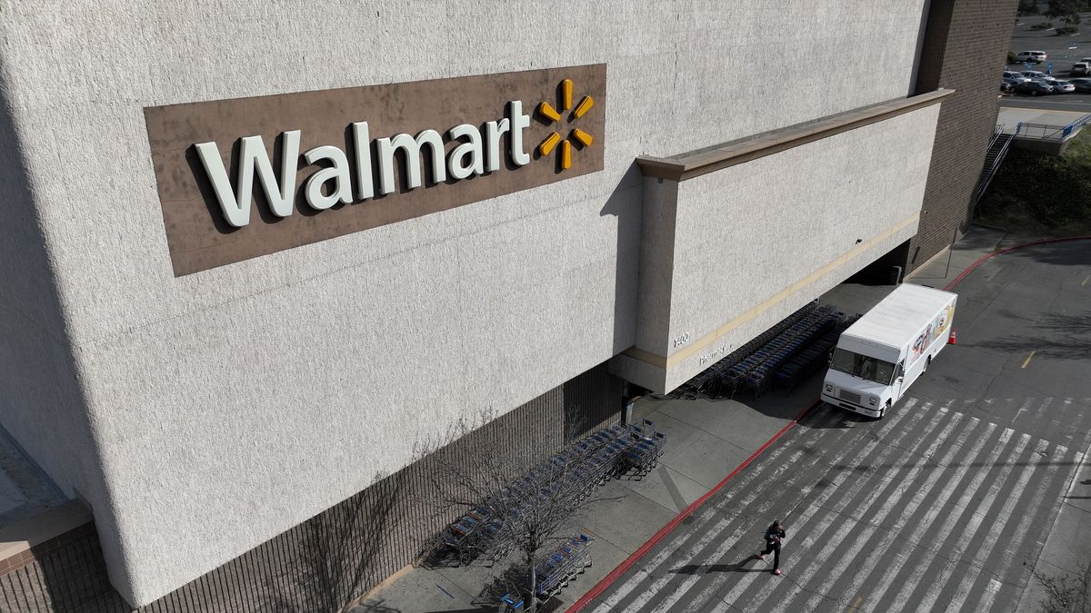 RICHMOND, CALIFORNIA - FEBRUARY 21: In an aerial view, A sign is seen posted on the exterior of a Walmart store on February 21, 2023 in Richmond, California. Walmart reported a stronger than expected holiday quarter but warns of slower profit growth and lower sales in the coming year. (Photo by Justin Sullivan/Getty Images)