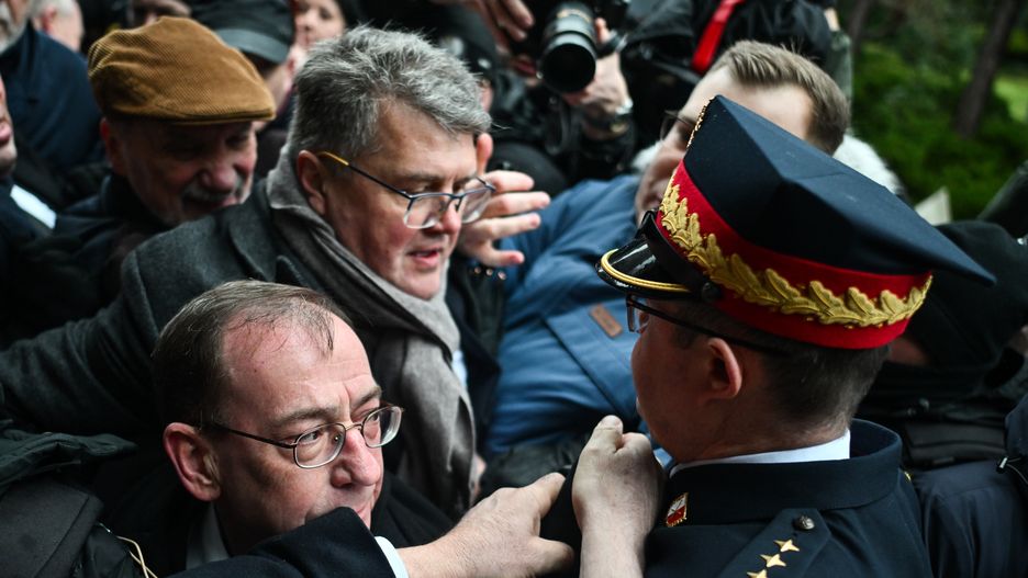 WARSAW, POLAND - FEBRUARY 07: Conservative right-wing former Minister of Interior and Administration of Poland, Mariusz Kaminski (C) who was released from prison after a second presidential pardon attempts to enter the Parliament chamber surrounded by conservative MPs of the Law and Justice Party  on February 07, 2024 in Warsaw, Poland. Former Polish Interior Minister Mariusz Kaminski and his deputy Maciej Wasik were detained by police and taken to prison in January after being convicted of abuse of power  amid a standoff between the new centrist government and the previous conservative administration. (Photo by Omar Marques/Getty Images)