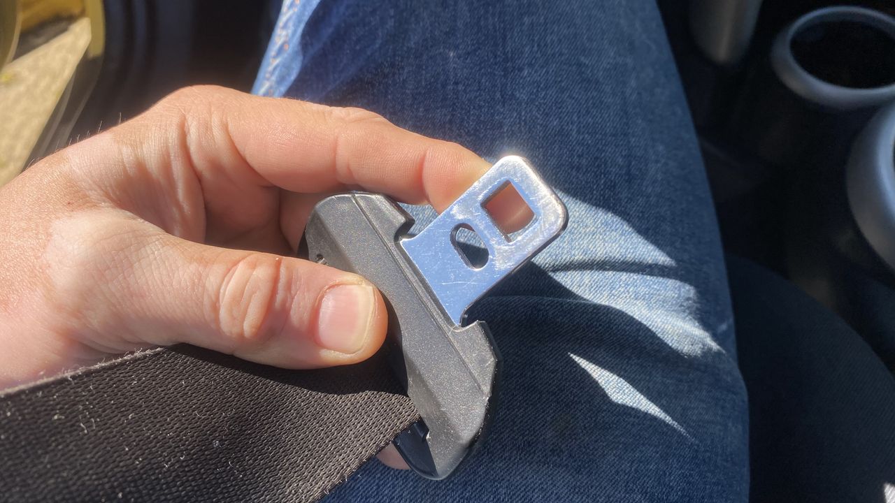 The seat belt buckle is not only for fastening yourself. It can also help you get out of the vehicle.
