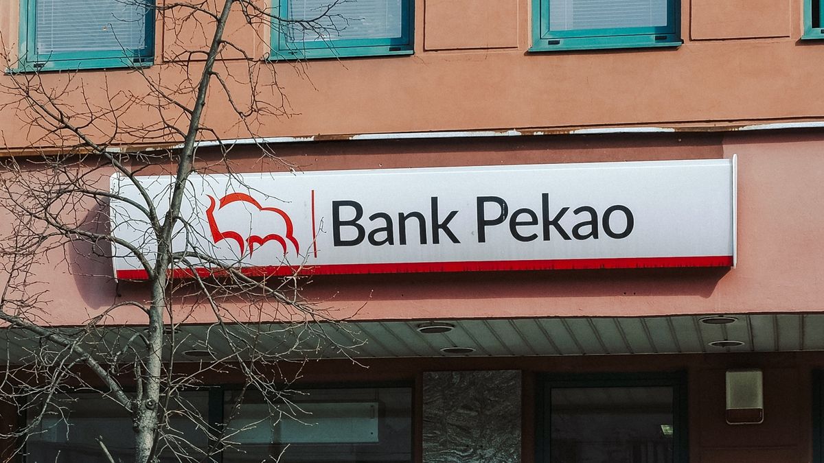 Customers wait for a Bank Pekao SA bank branch to open in Warsaw, Poland, on Monday, March 20, 2023. Poland's February retail sales fell 5% as prices rose 10.8% from a year earlier, data from the Central Statistical Office in Warsaw shows. Photographer: Damian Lemaski/Bloomberg via Getty Images