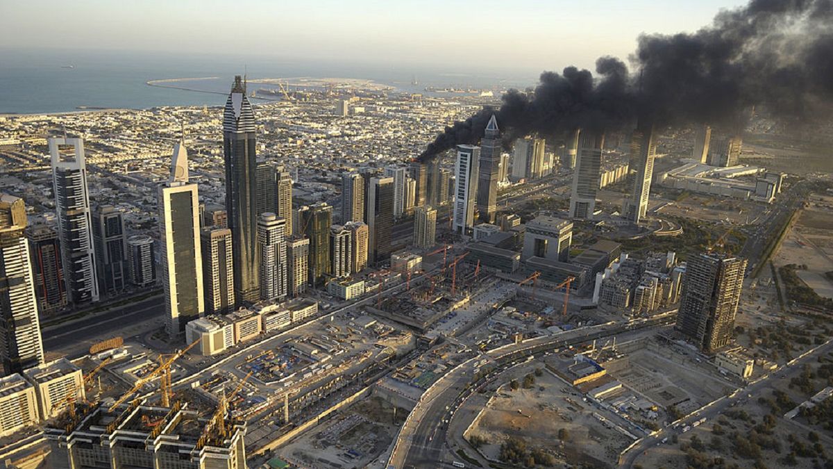 Dubai Building Fire
DUBAI, UNITED ARAB EMIRATES - MARCH 20: A blazing fire broke out atop a thirty-story builiding on March 20, 2007 on Shaikh Zayed Road in Dubai. The smoke from the fire blackened Dubai's skyline starting in the early morning hours of March 20, 2007. The fire caused only minor injuries to two men who were working construction atop the building. The fire was under control and finally extinguished only a couple of hours after it began. (Photo by Joe McNally/Getty Images)
Joe McNally
Shaikh Zayed Road, black, blaze, broke, broke out, building, construction, contained, dubai, early, early morning, fire, flames, injuries, minor, morning, rooftop, skyline, smoke, spark, spread, united arab emirates