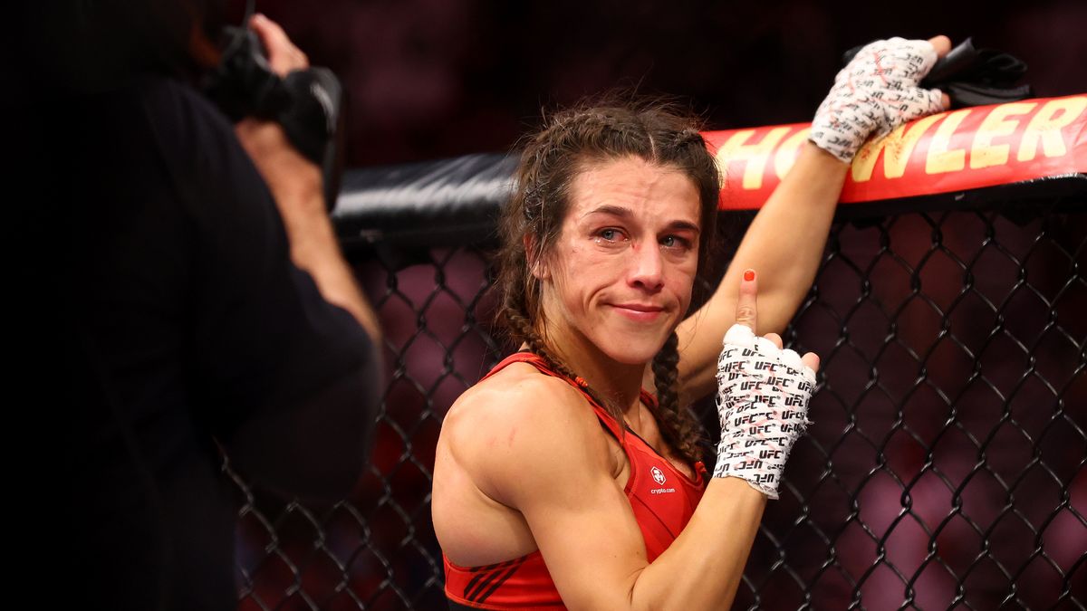 SINGAPORE, SINGAPORE - JUNE 12: Joanna Jedrzejczyk of Poland reacts after her strawweight bout against Zhang Weili of China during UFC 275 at Singapore Indoor Stadium on June 12, 2022 in Singapore. Zhang Weili of China won via a second round knockout. (Photo by Yong Teck Lim/Getty Images)