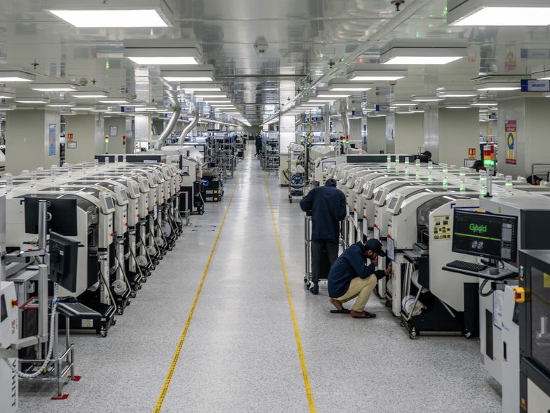 Employees work on the SMT (surface mount technology) shop floor where components are mounted on a PCB (printed circuit board) at Padget Electronics Pvt., a subsidiary of Dixon Technologies Ltd., in Noida, India, on Friday, March 22, 2024. Dixon Technologies Ltd., an Indian contract manufacturer, is benefitting from a boom in new business from clients like Chinese smartphone maker Xiaomi Corp. and South Korea's Samsung Electronics Co. wishing to use its factories to manufacture goods for India's rising middle class. Photographer: Prashanth Vishwanathan/Bloomberg via Getty Images