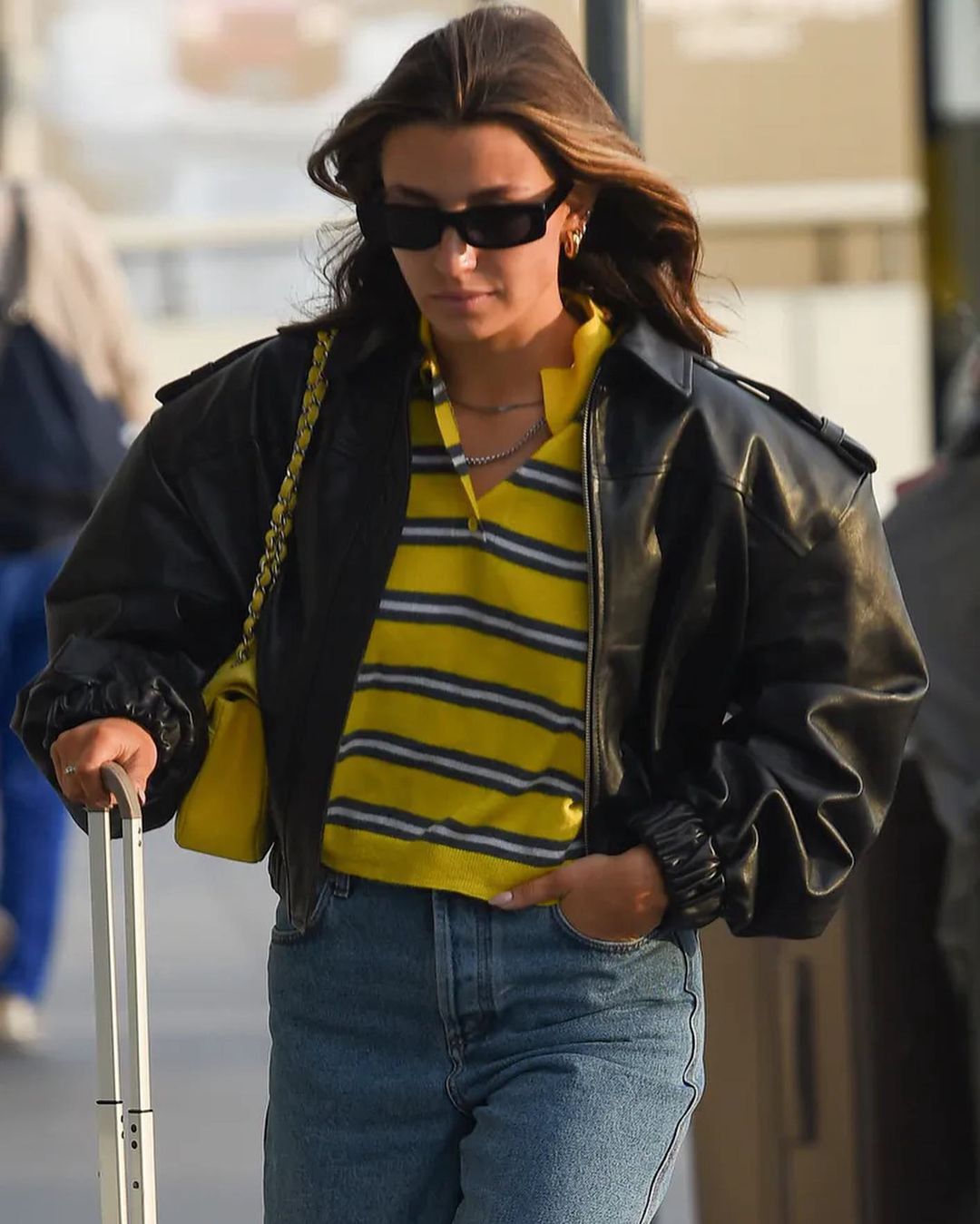 Julia Wieniawa in a yellow striped polo shirt