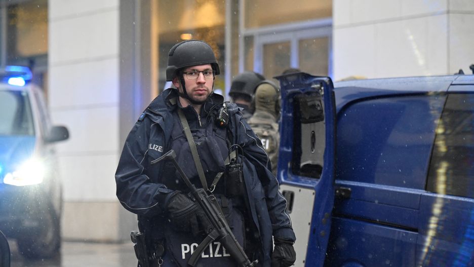 Police officers secure the area at a Christmas market in Dresden, Germany, December 10, 2022.