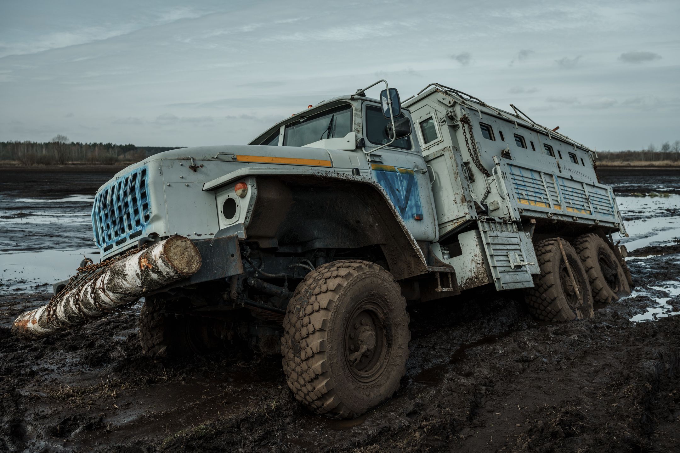 Moshchun Village In The Aftermath Of Russian OffensiveMOSHCHUN, UKRAINE - APRIL 8: Damaged Russian vehicle marked V by Russian troops and then re-marked UA by Ukrainians bogged down in the mud on April 8, 2022 in Moshchun, Ukraine. Moshchun village became one of the locations where clashes took place in the first days of the attacks between Russia and Ukraine starting on February 24, due to its location on the road to Hostomel and Irpin. Moshchun, which displays the deepest traces of the war, came to the brink of a humanitarian crisis. (Photo by Serhii Mykhalchuk/Global Images Ukraine via Getty Images)Global Images Ukraine