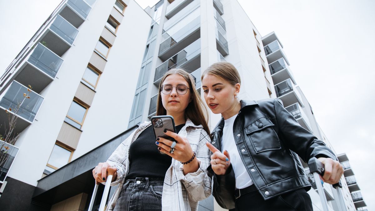 Two gorgeous female friends standing with luggages near city building, carefully looking at phone screen and trying to get bearings in area.
Two gorgeous female friends, lady in glasses and woman in black leather jacket, arrived for business trip, standing with luggages on street near city building, carefully looking at phone screen and trying to get bearings.
Tatsiana Volkava