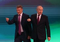 MOSCOW, RUSSIA - NOVEMBER 24 (RUSSIA OUT) Russian President Vladimir Putin (R) and Sberbank President Herman Gref (L) point during the AIJ 2022 (Artifical Intelligence Journey) Conference, November,24,2022, in Moscow, Russia. President Putin delivered a speech at the conference, hosted by Sberbank, whose SWIFT was blocked by Western sanctions due to the Russian military invasion on Ukraine. (Photo by Contributor/Getty Images)