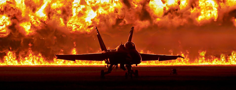 F18 Hornet in front of a wall of fire at the Homecoming Airshow in Pensacola