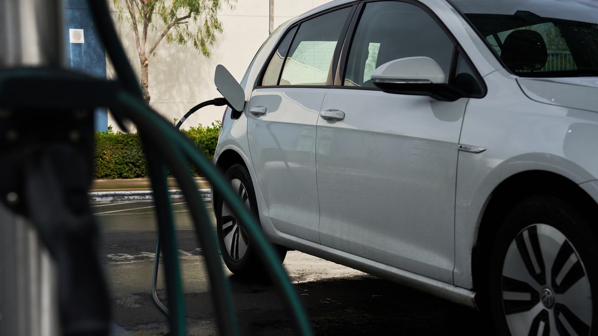 A Volkswagen e-Golf charges at a electric vehicle (EV) charger, owned and operated by Shell Recharge Solutions, outside an elementary school in Escondido, California, US, on Sunday, Jan. 29, 2023. Shell Plc agreed to buy US electric-vehicle charging firm Volta Inc. as the fossil-fuel giant works to keep pace with the transition to low-carbon mobility. Photographer: Bing Guan/Bloomberg via Getty Images
