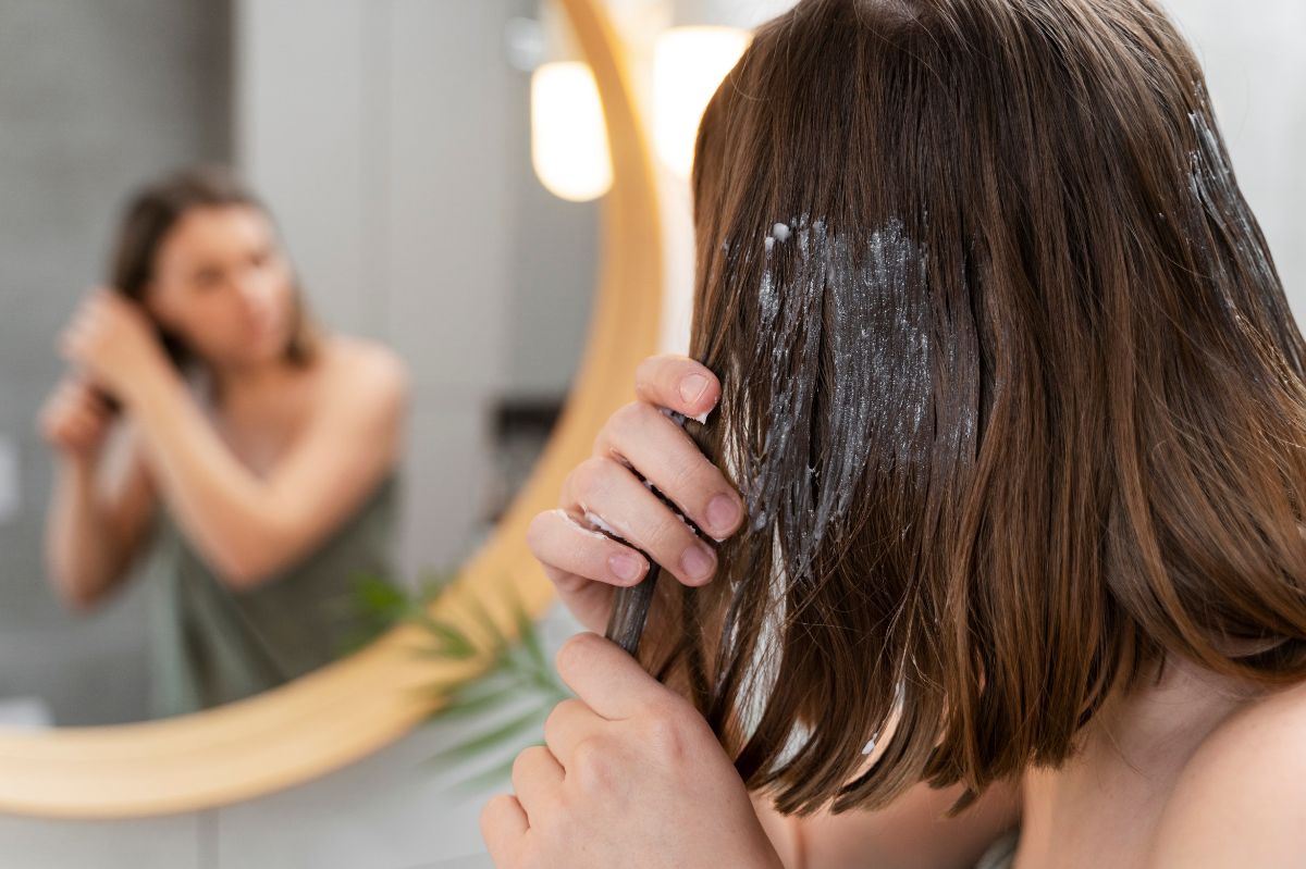 Applying a hair mask.