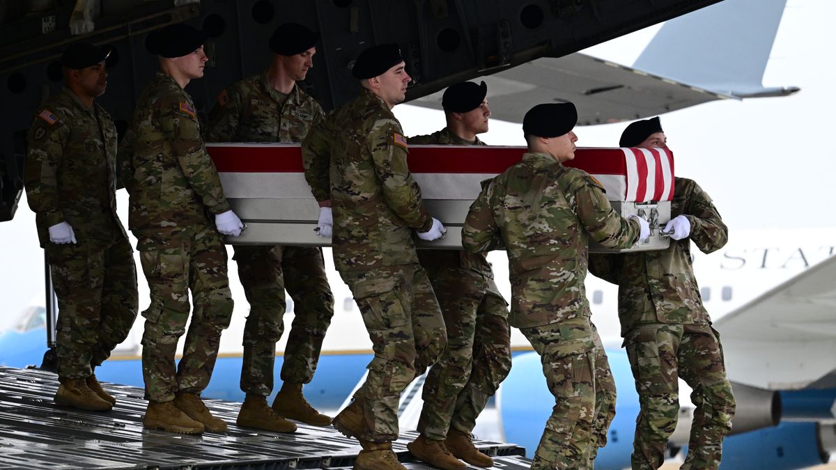 DOVER, DELAWARE, UNITED STATES - MARCH 07: A U.S. Army carry team moves the flagged-draped coffins containing the remains US soldiers killed in the retaliatory Iranian strike on Kuwait's Port of Shuaiba, in Dover, Delaware, United States on March 07, 2026. U.S. Army Reserve Members Maj. Jeffrey OâBrien, Capt. Cody Khork, Chief Warrant Officer 3 Robert M. Marzan, Sgt. 1st Class Nicole Amor, Sgt. 1st Class Noah Tietjens, and Sgt. Declan Coady, were killed in the retaliatory Iranian strike on Port of Shuaiba, Kuwait. (Photo by Kyle Mazza/Anadolu via Getty Images)