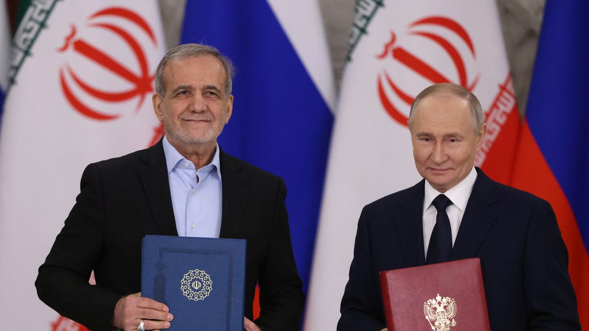 MOSCOW, RUSSIA - JANUARY 17 (RUSSIA OUT) Russian President Vladimir Putin (R) exchanges documents with Iranian President Masoud Pezeshkian (L) during their meeting at the Grand Kremlin Palace,  January 17, 2025, in Moscow, Russia. Pezeshkian arrived in Moscow for a treaty signing with Putin. (Photo by Contributor/Getty Images)