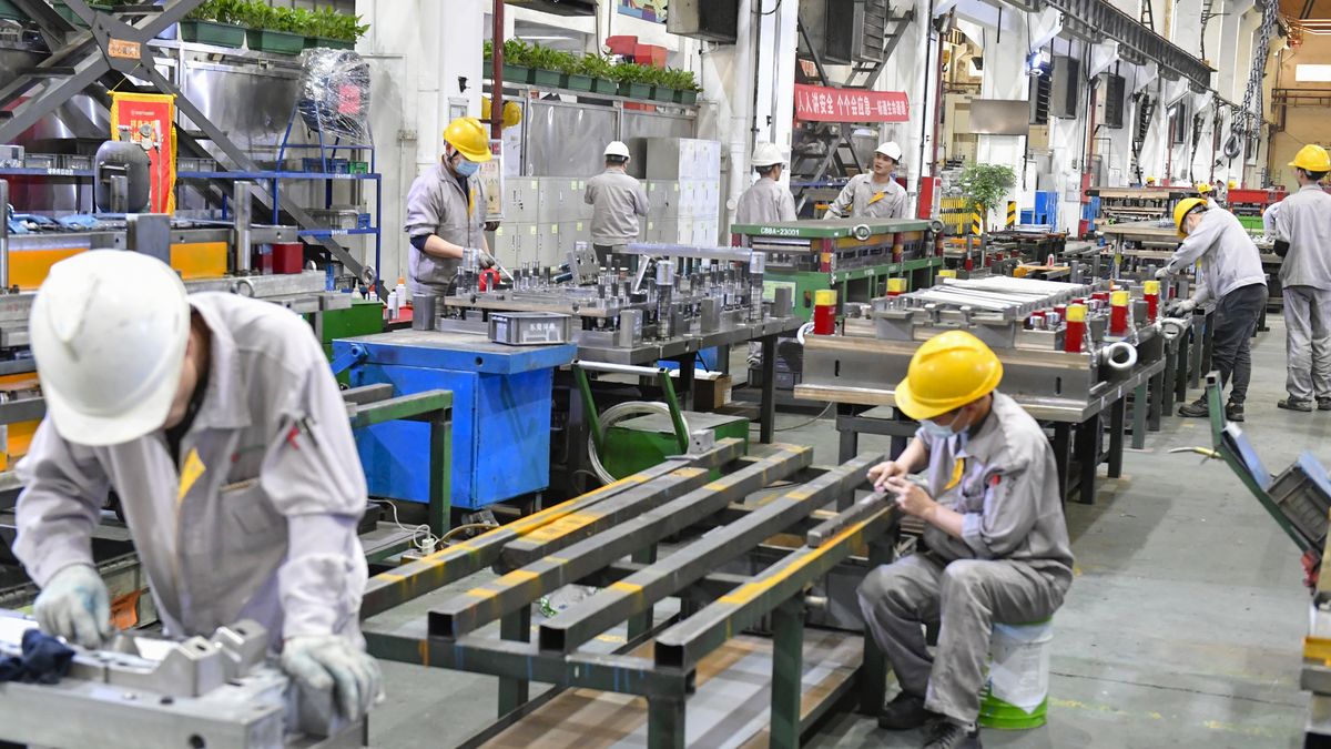 DONGGUAN, CHINA - JANUARY 24: Workers manufacture molds and hardware accessories for new energy vehicles at a factory ahead of the Spring Festival on January 24, 2025 in Dongguan, Guangdong Province of China. (Photo by VCG/VCG via Getty Images)