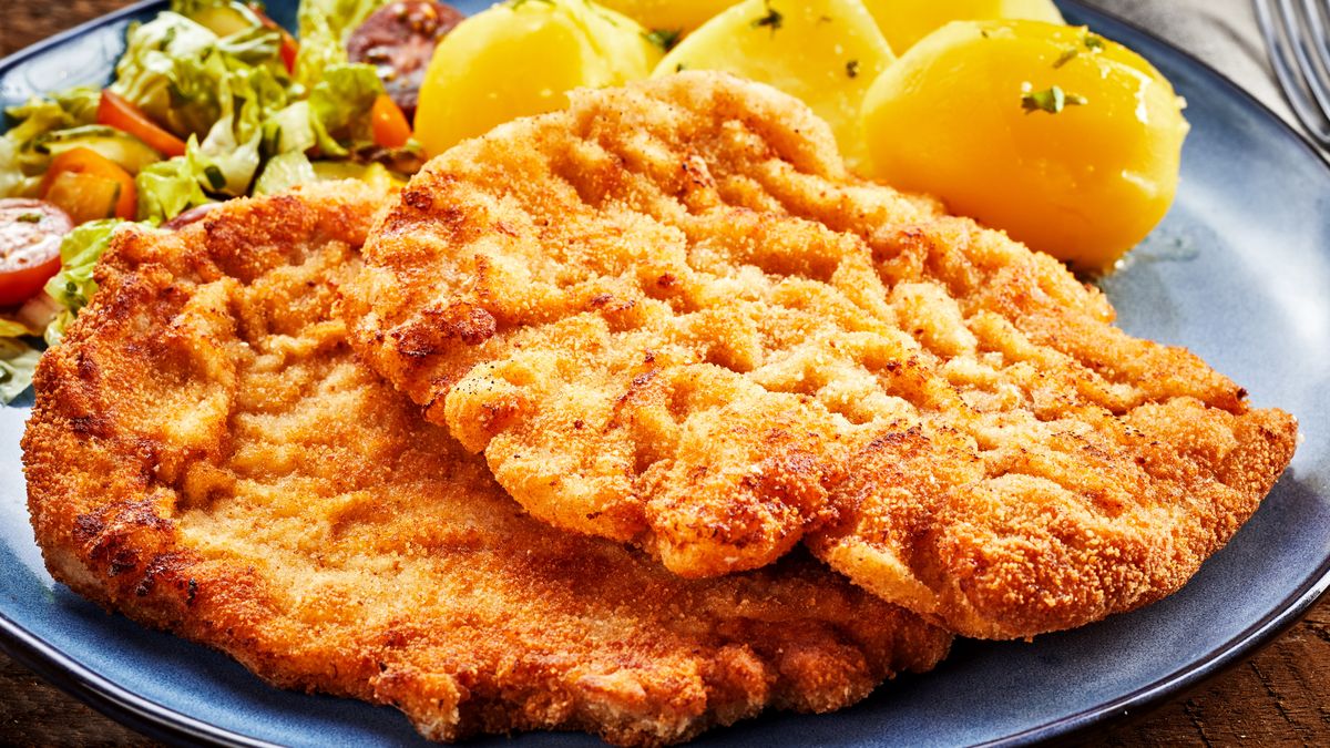 Pieces of Wiener schnitzel with potatoes
Pieces of Wiener golden fried schnitzel with boiled potatoes and salad close-up on grey plate
stockcreations
batter, breaded, crumbed, fried, meat, tender, veal, schnitzel, food, serving, potato, escalope, cutlet, austrian, wiener, cuisine, regional, speciality, boiled, breadcrumbs, closeup, portions, two, thin, cooking, golden, recipe, plate, restaurant, salad, wiener schnitzel, austria, dish, german, germany, meal, menu, serving size, tradition, traditional, chop, pork, batter, breaded, crumbed, fried, meat, tender, veal, schnitzel, food, serving, potato, escalope, cutlet, austrian, wiener, cuisine, regional, speciality, boiled, breadcrumbs, closeup, portions, two, thin, cooking, golden, recipe, plate, restaurant, salad, wiener schnitzel, austria, dish, german, germany, meal, menu, serving size, tradition, traditional, chop, pork