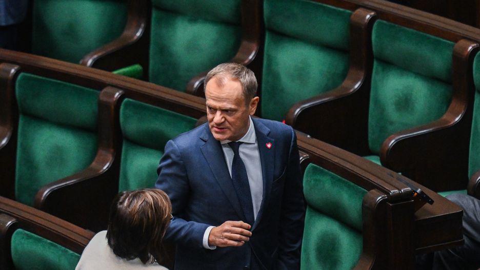 WARSAW, POLAND – DECEMBER 11: The leader of Civic Coalition (KO), Donald Tusk stands among members of his party during a parliament session on December 11, 2023 in Warsaw, Poland. A coalition of opposition parties, with former prime minister Donald Tusk at the helm, won a majority in October's general election, ending eight years of rule by the Law and Justice (PiS) party. (Photo by Omar Marques/Getty Images)