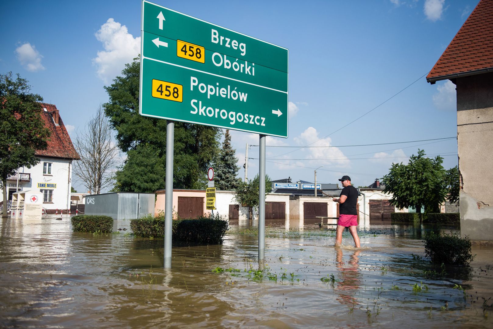 LEWIN BRZESKI, LOWER SILESIAN VOIVODESHIP, POLAND - 2024/09/18: A man stands on a flooded street in Lewin Brzeski city on south of Poland. In southwestern Poland, heavy rains and cyclones sweeping through central Europe have led to severe flooding. Rivers such as the Odra, Nysa Kodzka, and Bystrzyca experienced a sharp rise in water levels, causing numerous floods and the breach of flood embankments. Authorities are working to manage the situation, with ongoing efforts to prevent further damage. (Photo by Attila Husejnow/SOPA Images/LightRocket via Getty Images)