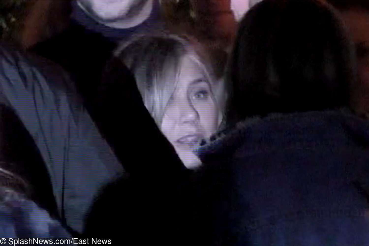 Jennifer Aniston ducks out of her 50th birthday party through a throng of friends and into a waiting car in Los Angeles, California. The 'friends' star was seen leaving the Sunset Tower hotel around 1am after spending the night celebrating with her famous friends - including ex-husband Brad Pitt.    Pictured:       World Rights,
