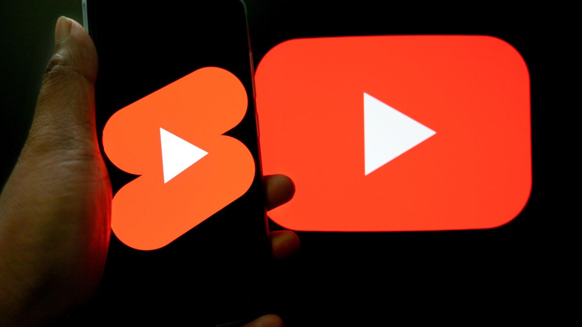 INDIA - 2025/02/12: In this photo illustration, a YouTube shorts logo is seen displayed on a smartphone with a YouTube Logo in the background. (Photo Illustration by Avishek Das/SOPA Images/LightRocket via Getty Images)