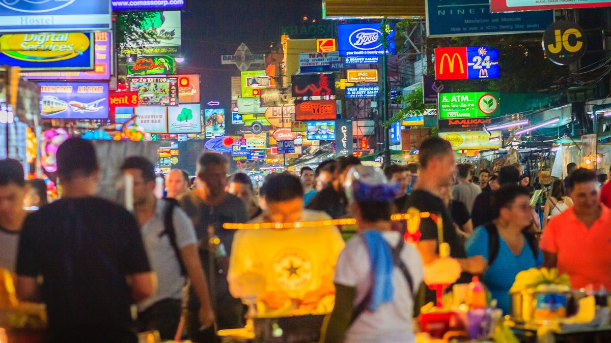 Bangkok, Thailand - March 2, 2017:  Tourists and backpackers visited at Khao San Road night market. Khao San Road is a famous low budget hotels and guesthouses area in Bangkok.Bangkok, Thailand - March 2, 2017:  Tourists and backpackers visited at Khao San Road night market. Khao San Road is a famous low budget hotels and guesthouses area in Bangkok.Kwhisky