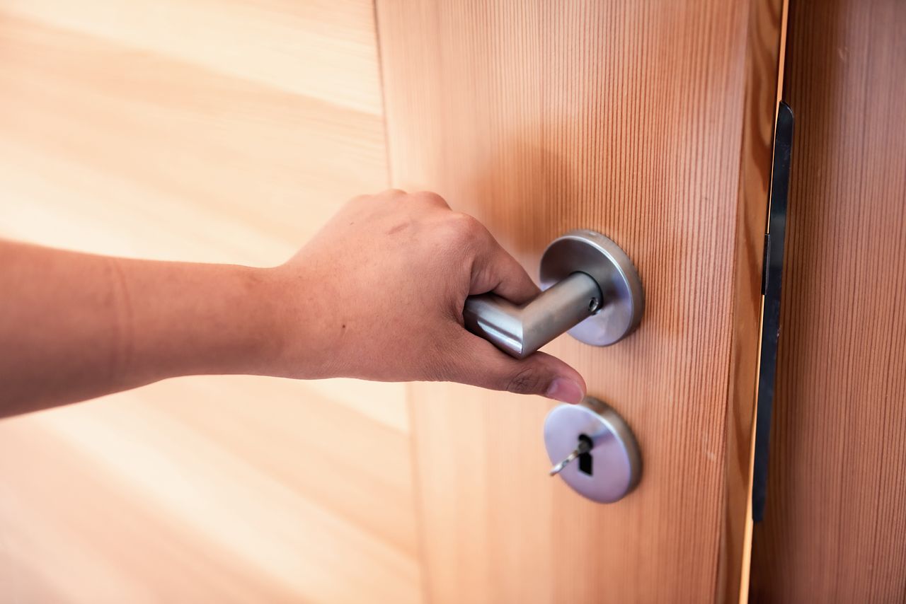 Woman Hand is Holding Door Knob While Opening a Door in Bedroom, Lock Security System and Access Safety of Doorway., Interior Design of Doorknob Entering to Accessibility Private Room
door, open, doorknob, entrance, handle, key, bedroom, lock, room, home, access, doorway, entry, exit, safety, security, gate, details, accessibility, enter, frosted, inside, privacy, residential, interior, knob, metallic, apartment, architecture, building, business, close, close-up, design, female, frame, hand, holding, house, human, office, person, private, steel, system, women, wooden, background, keyhole, metal