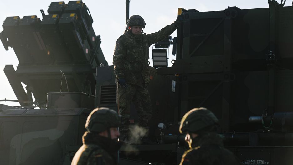 JASIONKA, POLAND - JANUARY 23: A german soldier stands on the top of a truck as he and others unload the US made MIM-104 Patriot surface-to-air missile (SAM) system on January 23, 2025 in Jasionka, Poland. Germany recently redeployed a Patriot air defense system in Poland, its NATO ally. (Photo by Omar Marques/Getty Images)
