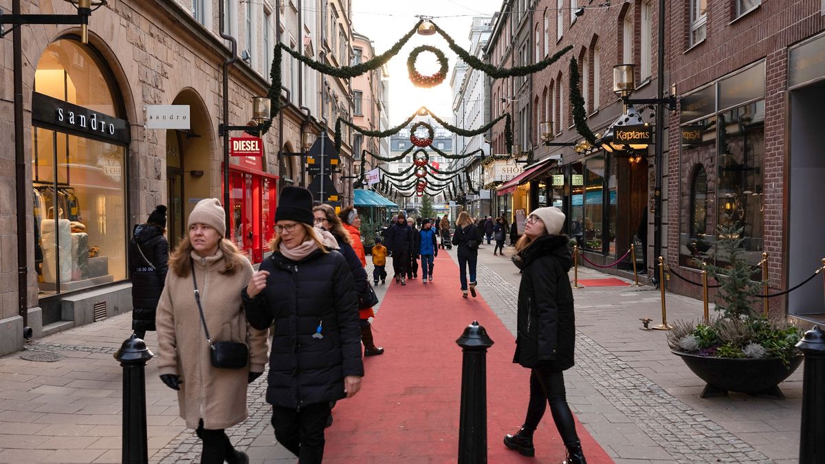 Shoppers walk along a shopping street, following the introduction of new coronavirus measures, in Stockholm, Sweden, on Tuesday, Dec. 28, 2021. According to forecasts from the country's public health agency, Sweden could see the highest number of daily infections since the beginning of the pandemic within a few weeks. Photographer: Loulou d'Aki/Bloomberg via Getty Images