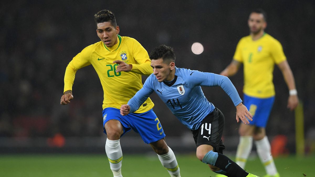 Getty Images / Mike Hewitt / Na zdjęciu: Roberto Firmino (z lewej) i Lucas Torreira (z prawej)