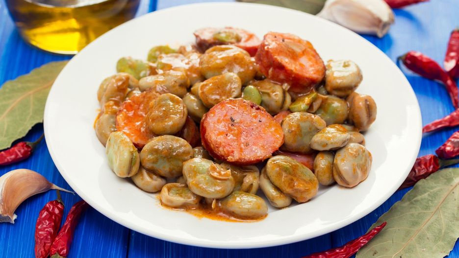 beans with smoked sausages on white dish