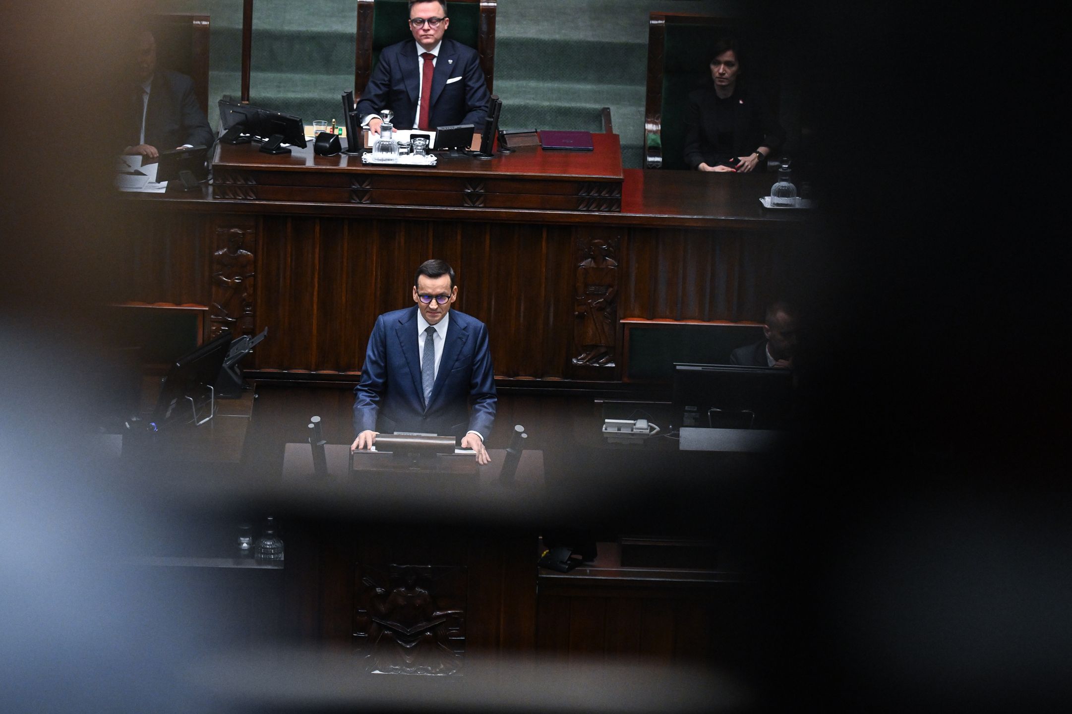 WARSAW, POLAND – DECEMBER 11: Prime Minister, Mateusz Morawiecki delivers a speech ahead of a vote of confidence on his government cabinet during a parliament session on December 11, 2023 in Warsaw, Poland. A coalition of opposition parties, with former prime minister Donald Tusk at the helm, won a majority in October's general election, ending eight years of rule by the Law and Justice (PiS) party. (Photo by Omar Marques/Getty Images)