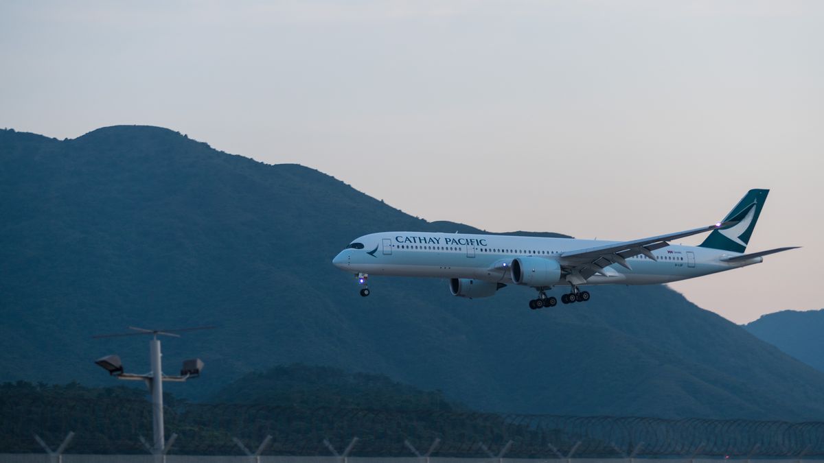 An Airbus A350-941 of Cathay Pacific lands at Hong Kong International Airport. (Photo by Marc Fernandes/NurPhoto via Getty Images)